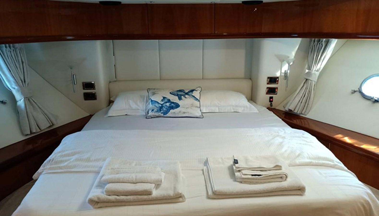 a bed with white sheets aboard 94 YACHT Yacht for Sale
