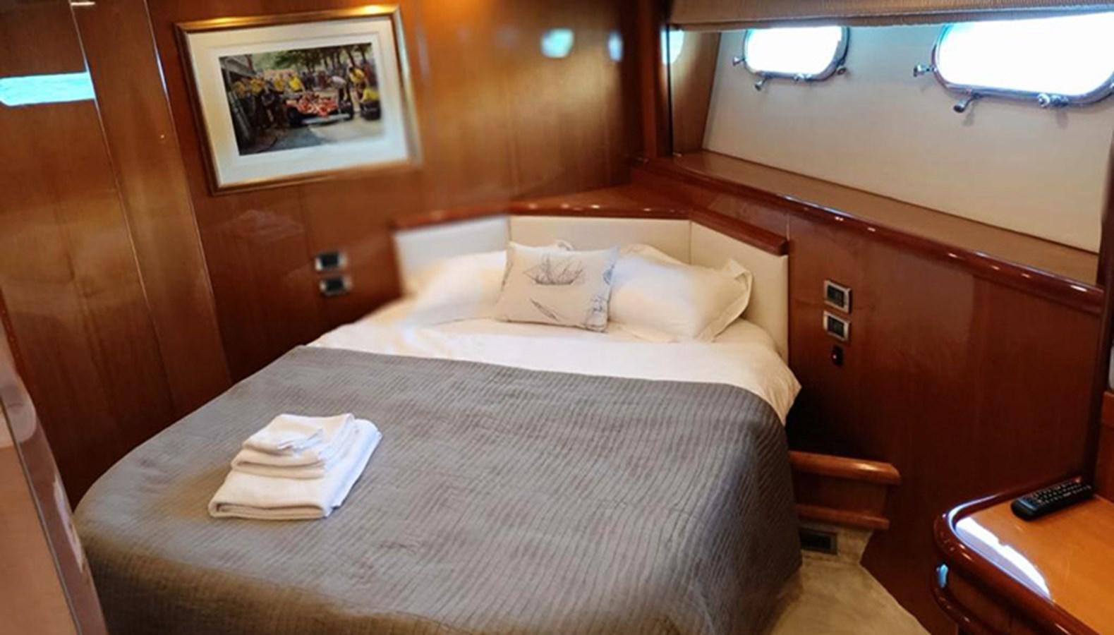 a bed with a white sheet and pillows aboard 94 YACHT Yacht for Sale