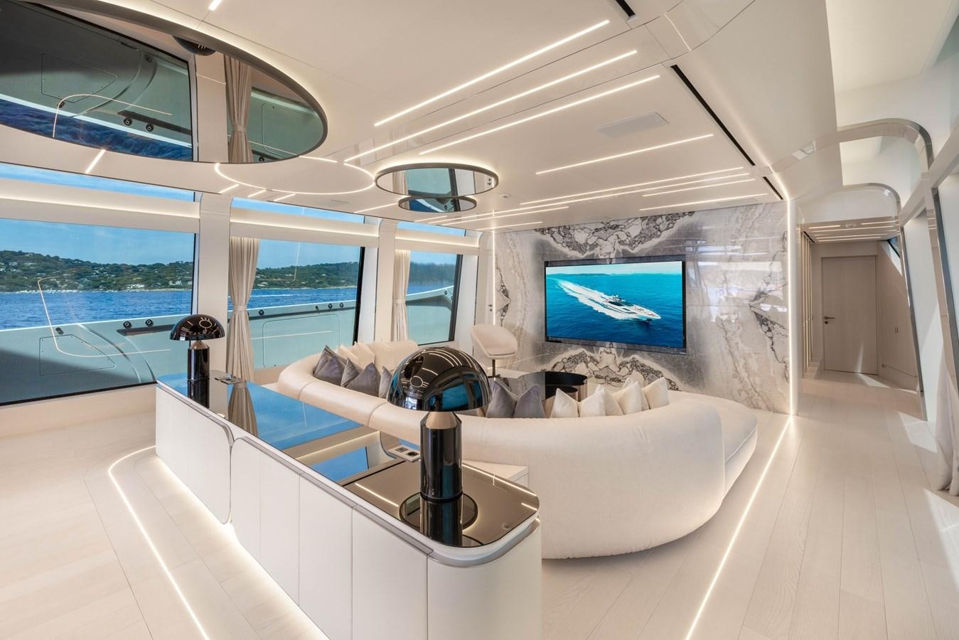 a room with a large window and a large screen aboard N1 Yacht for Sale