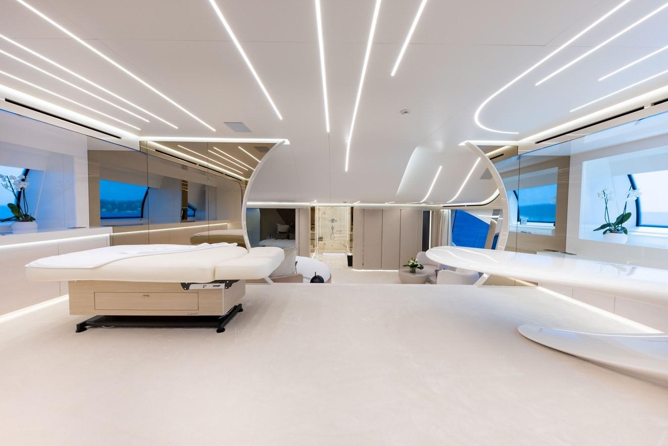 a room with several beds aboard N1 Yacht for Sale