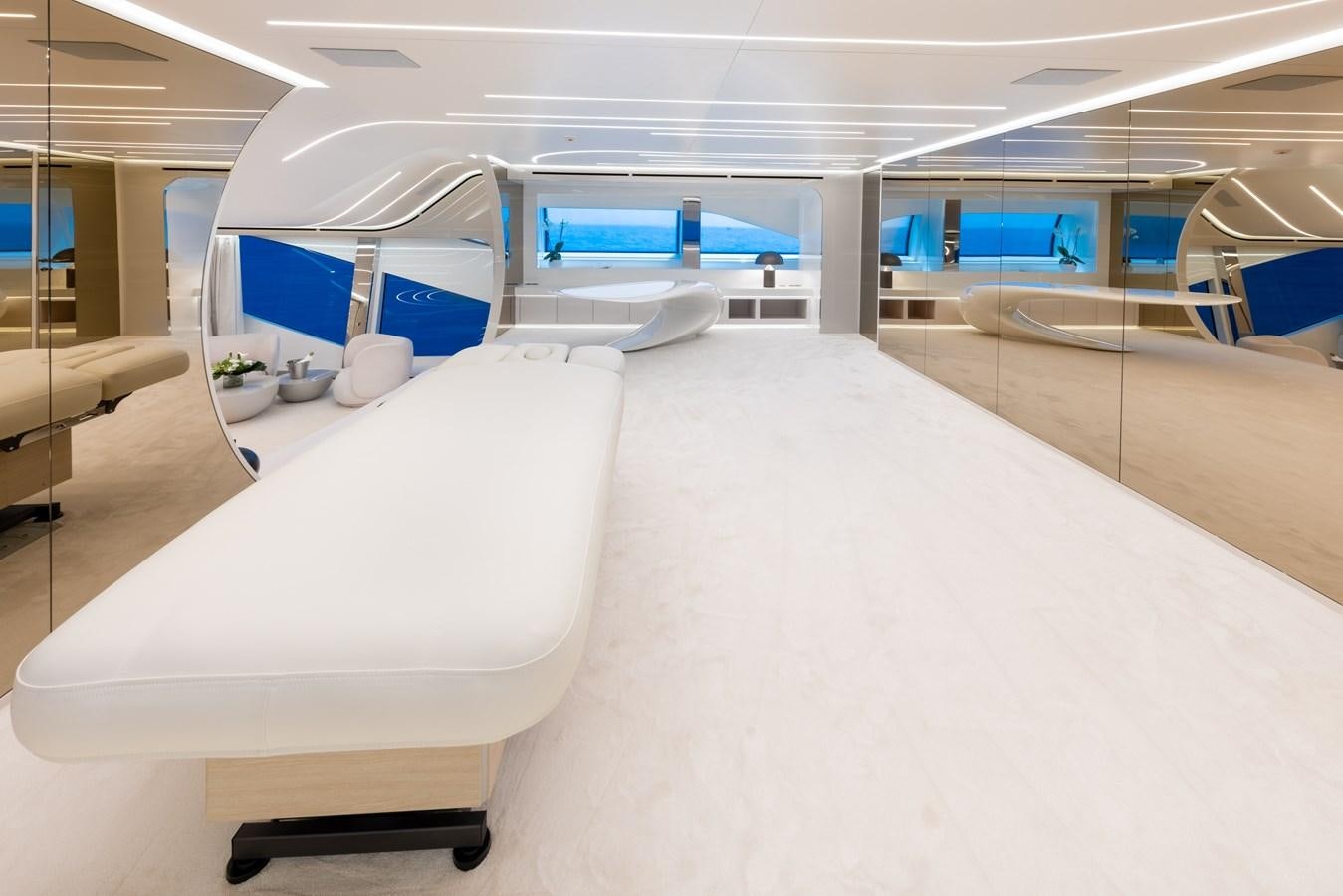 a room with beds and a window aboard N1 Yacht for Sale