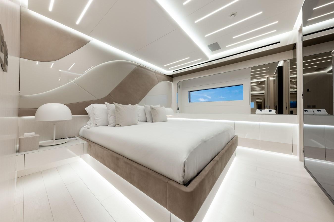 a room with a bed and a window aboard N1 Yacht for Sale