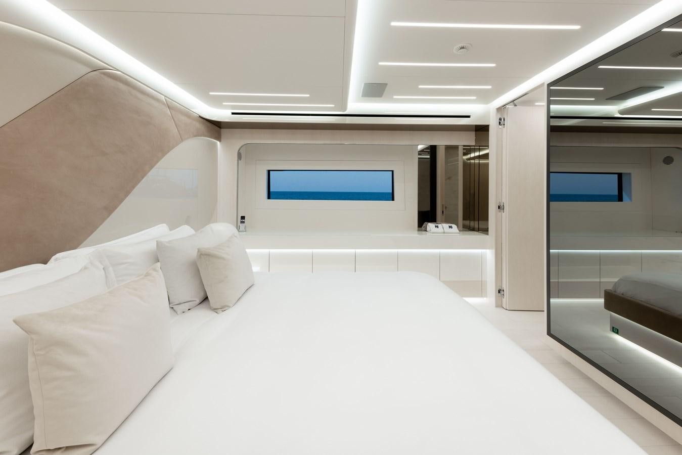 a room with a bed and a window aboard N1 Yacht for Sale