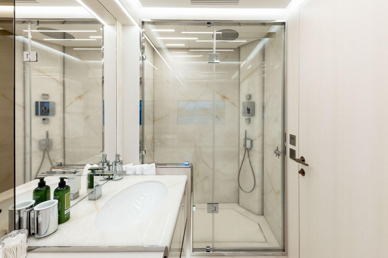 a bathroom with a tub and shower aboard N1 Yacht for Sale