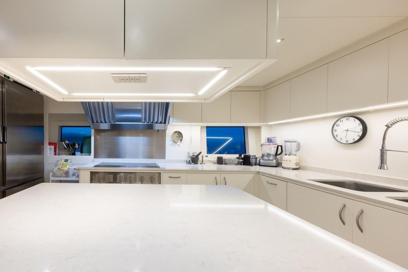 a kitchen with a large island aboard N1 Yacht for Sale