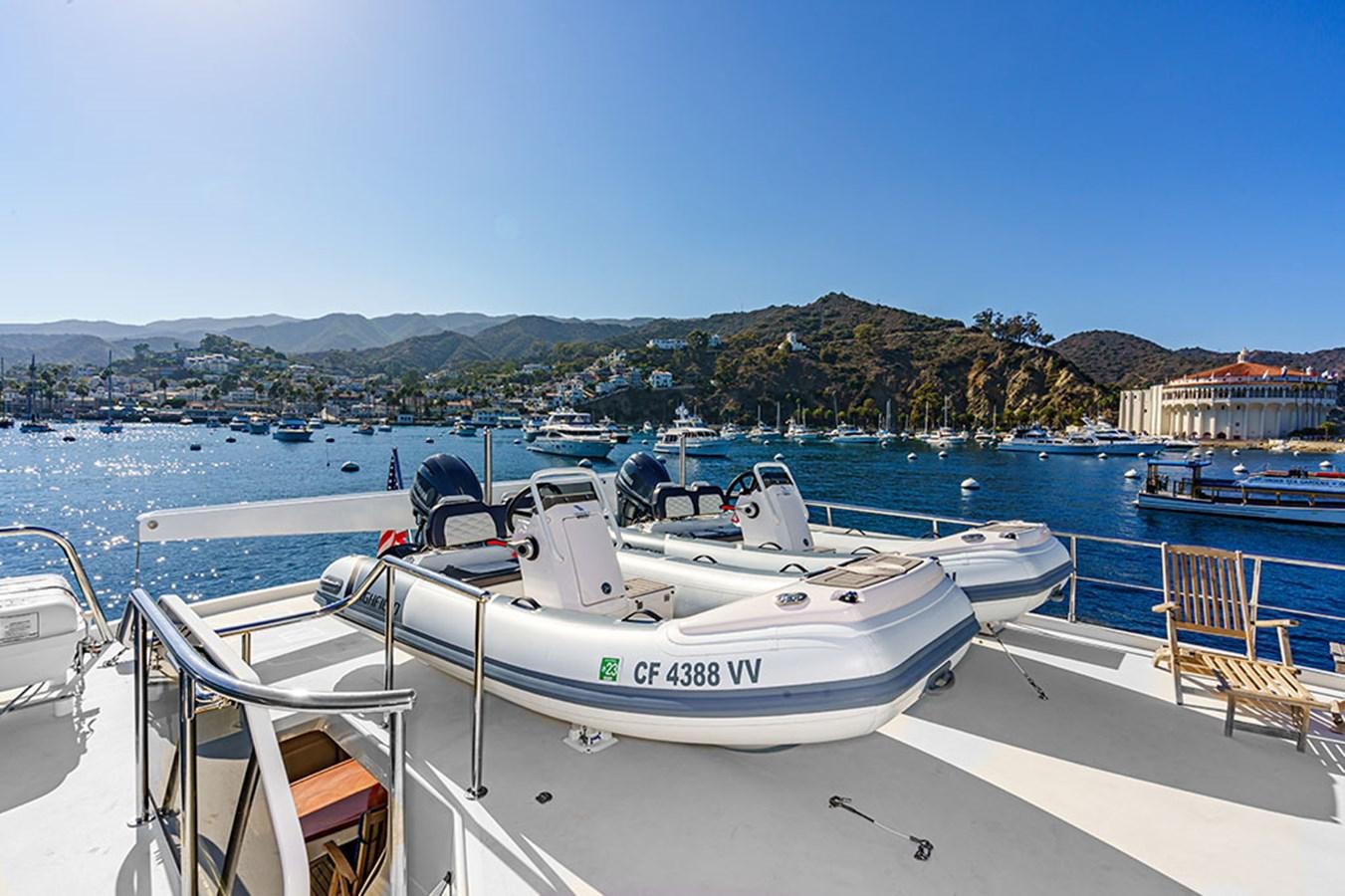 a boat parked on a dock aboard WICKED COOL Yacht for Sale