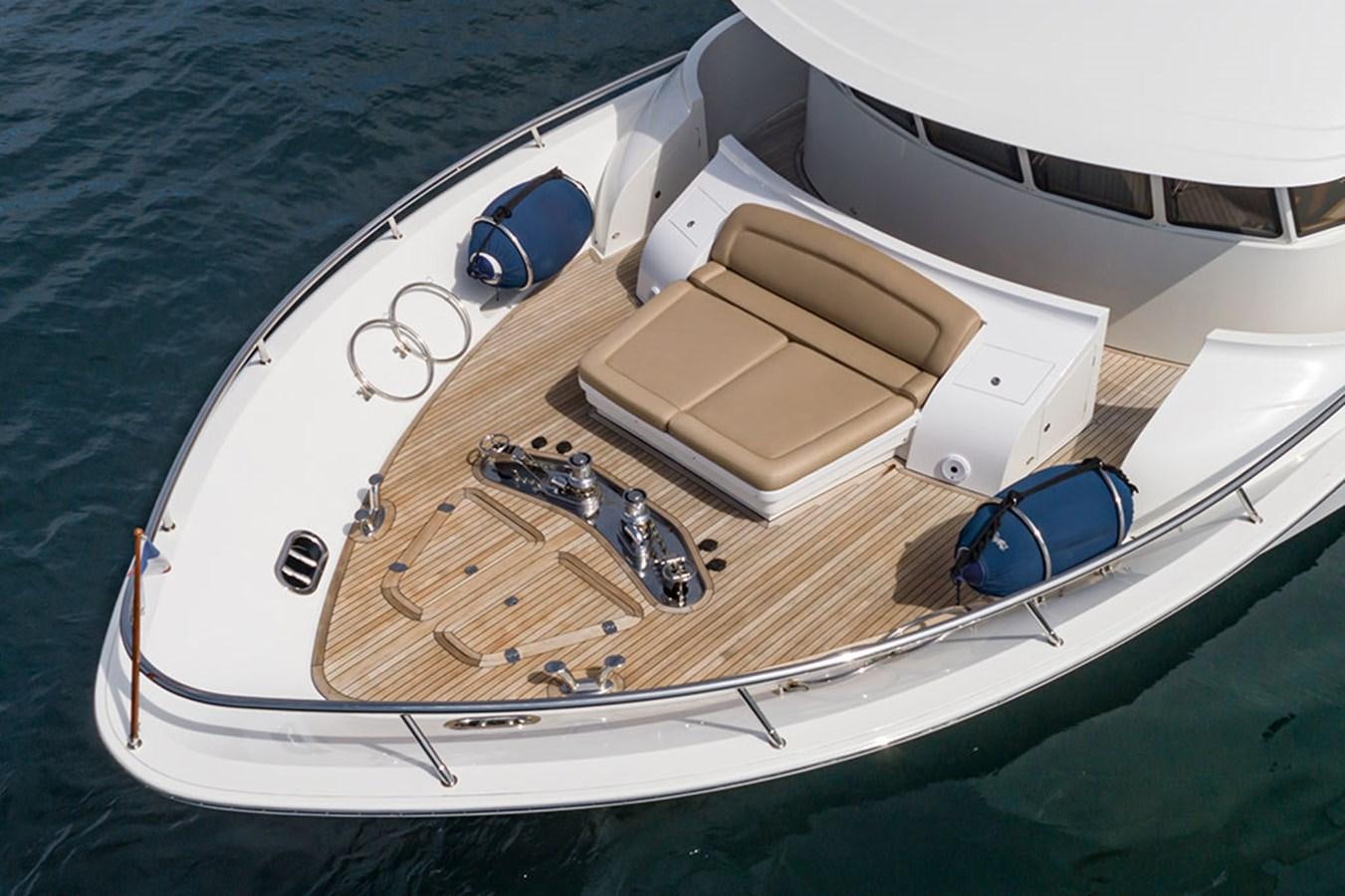 a boat with a satellite dish on the front aboard WICKED COOL Yacht for Sale