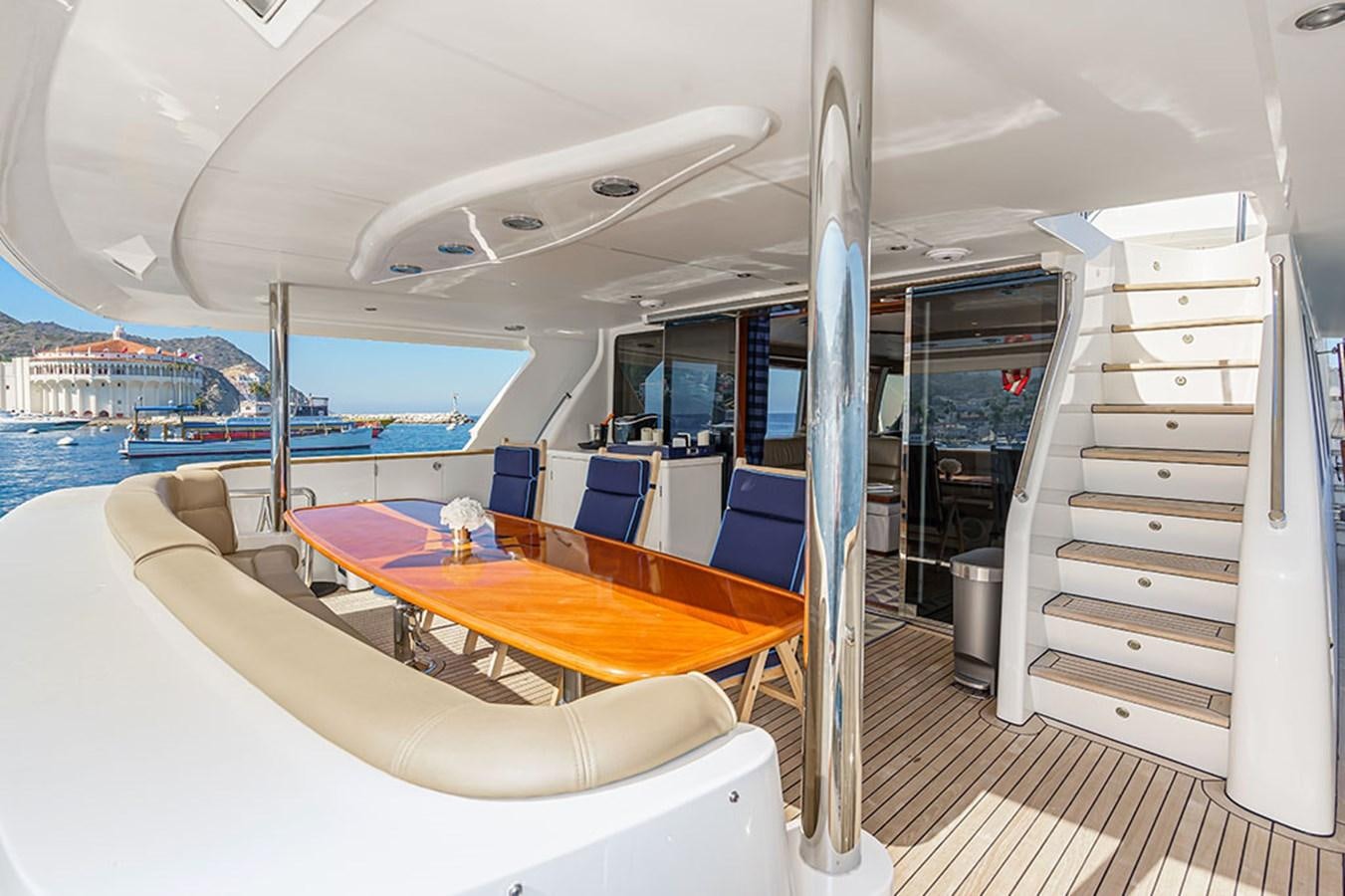 a boat with a table and chairs aboard WICKED COOL Yacht for Sale