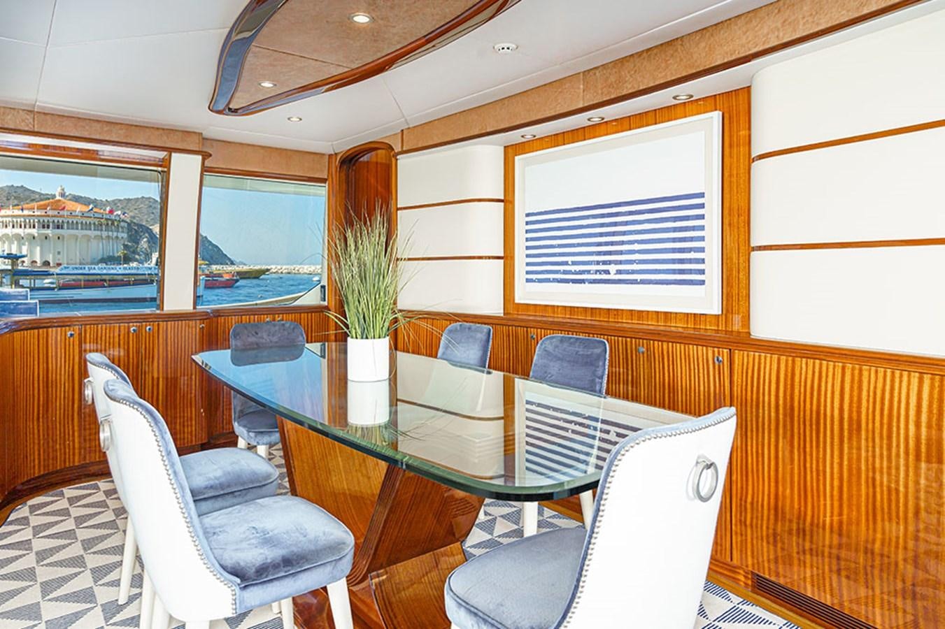 a table and chairs in a room aboard WICKED COOL Yacht for Sale