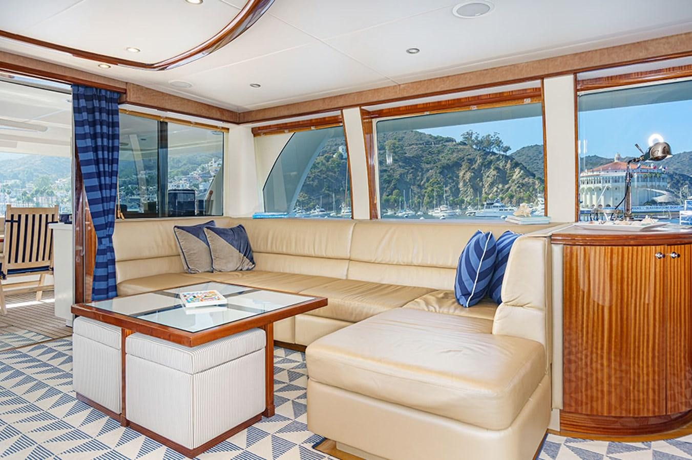 a living room with a couch and a table aboard WICKED COOL Yacht for Sale