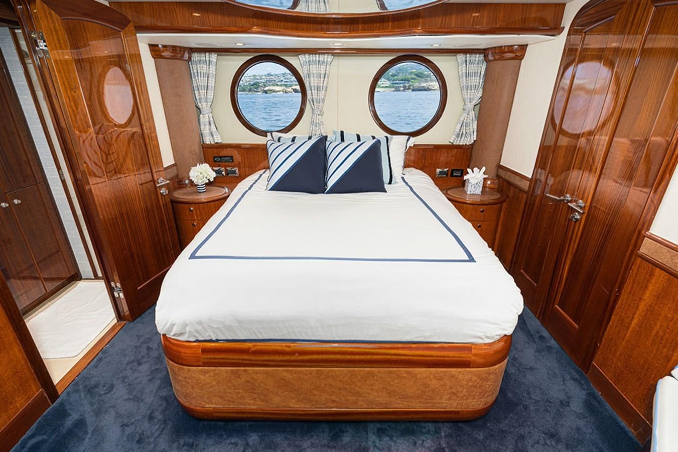 a bed in a room aboard WICKED COOL Yacht for Sale