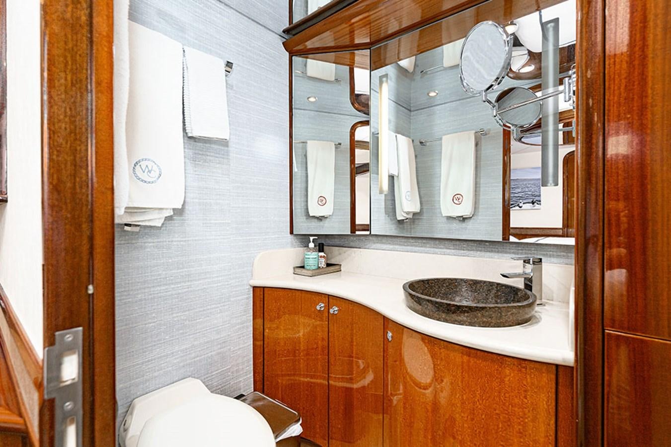 a bathroom with a sink and toilet aboard WICKED COOL Yacht for Sale