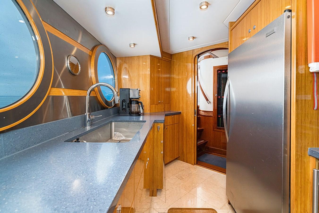 a kitchen with stainless steel appliances aboard WICKED COOL Yacht for Sale