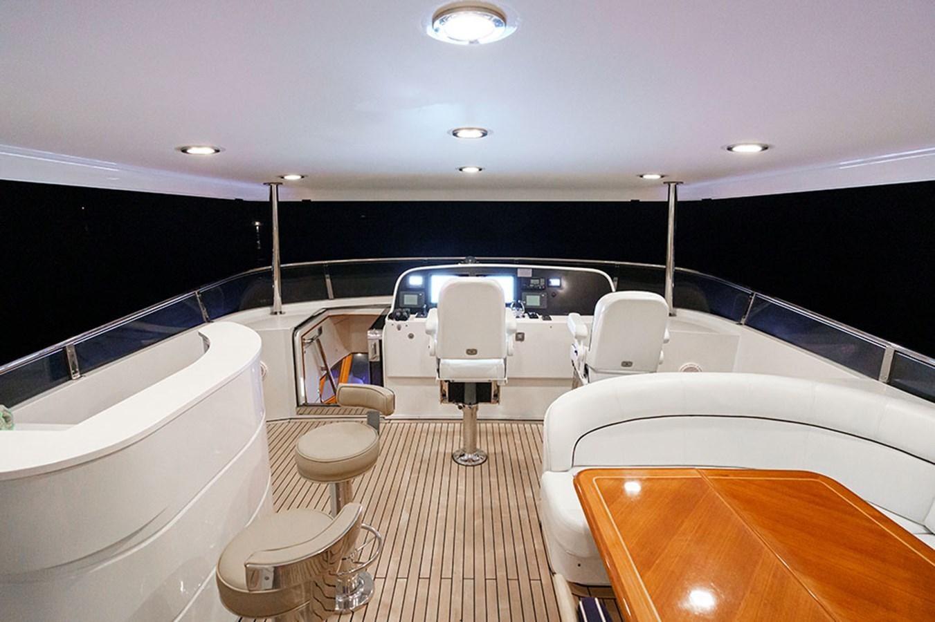 a large room with a tub and a chair aboard WICKED COOL Yacht for Sale