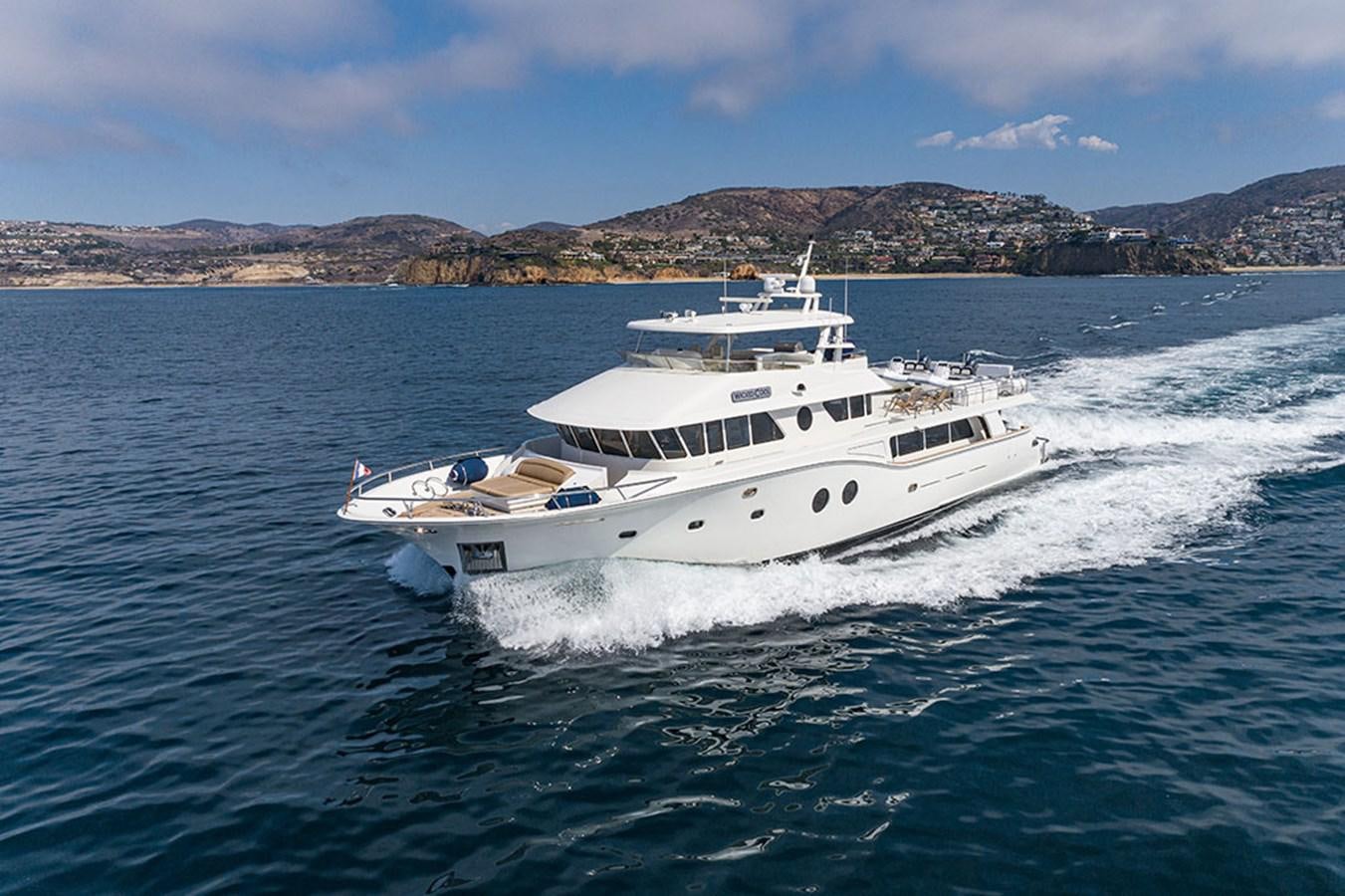 a white yacht on the water aboard WICKED COOL Yacht for Sale