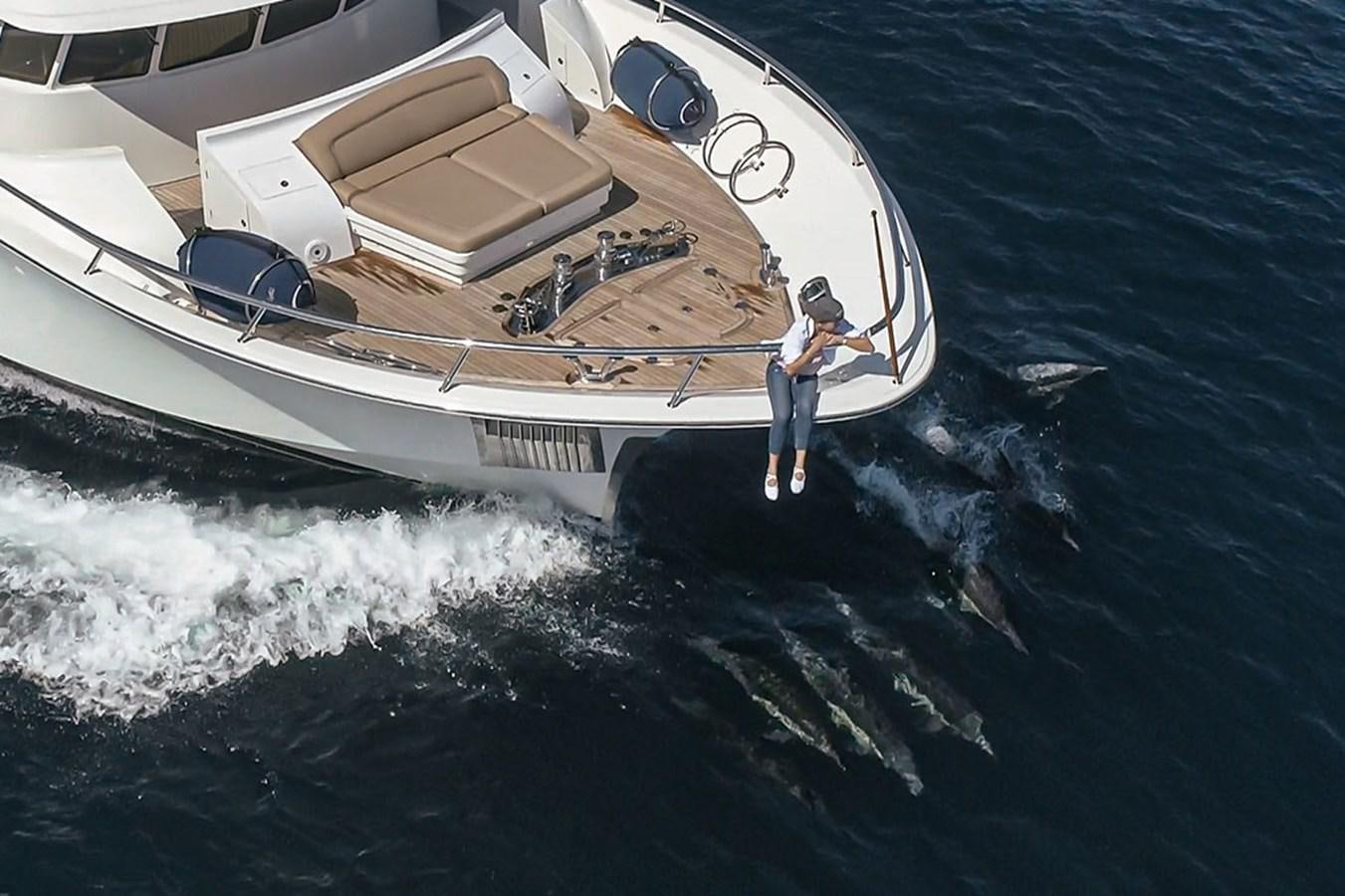 a person standing on a boat aboard WICKED COOL Yacht for Sale