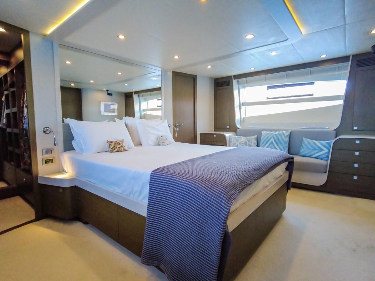 a large bedroom with a bed aboard MELITEA Yacht for Sale