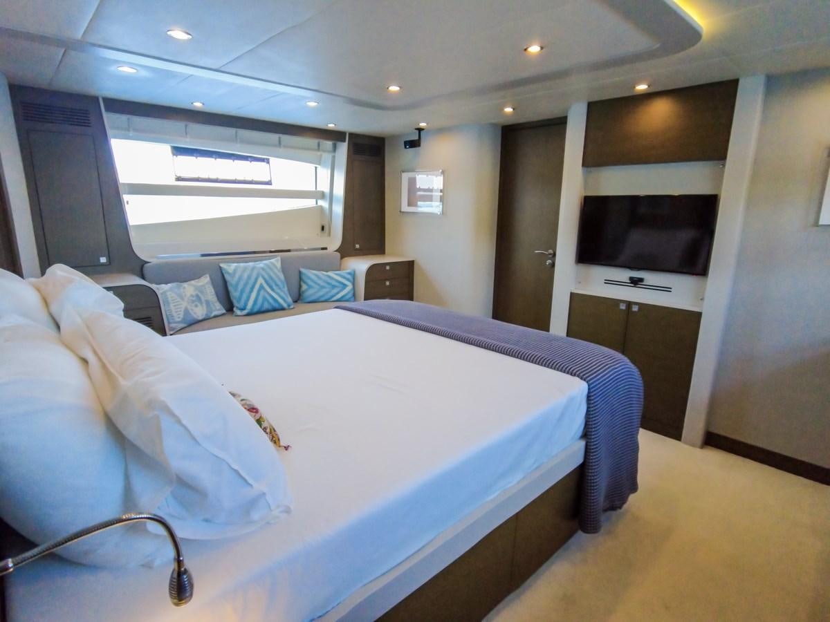 a room with beds and a tv aboard MELITEA Yacht for Sale