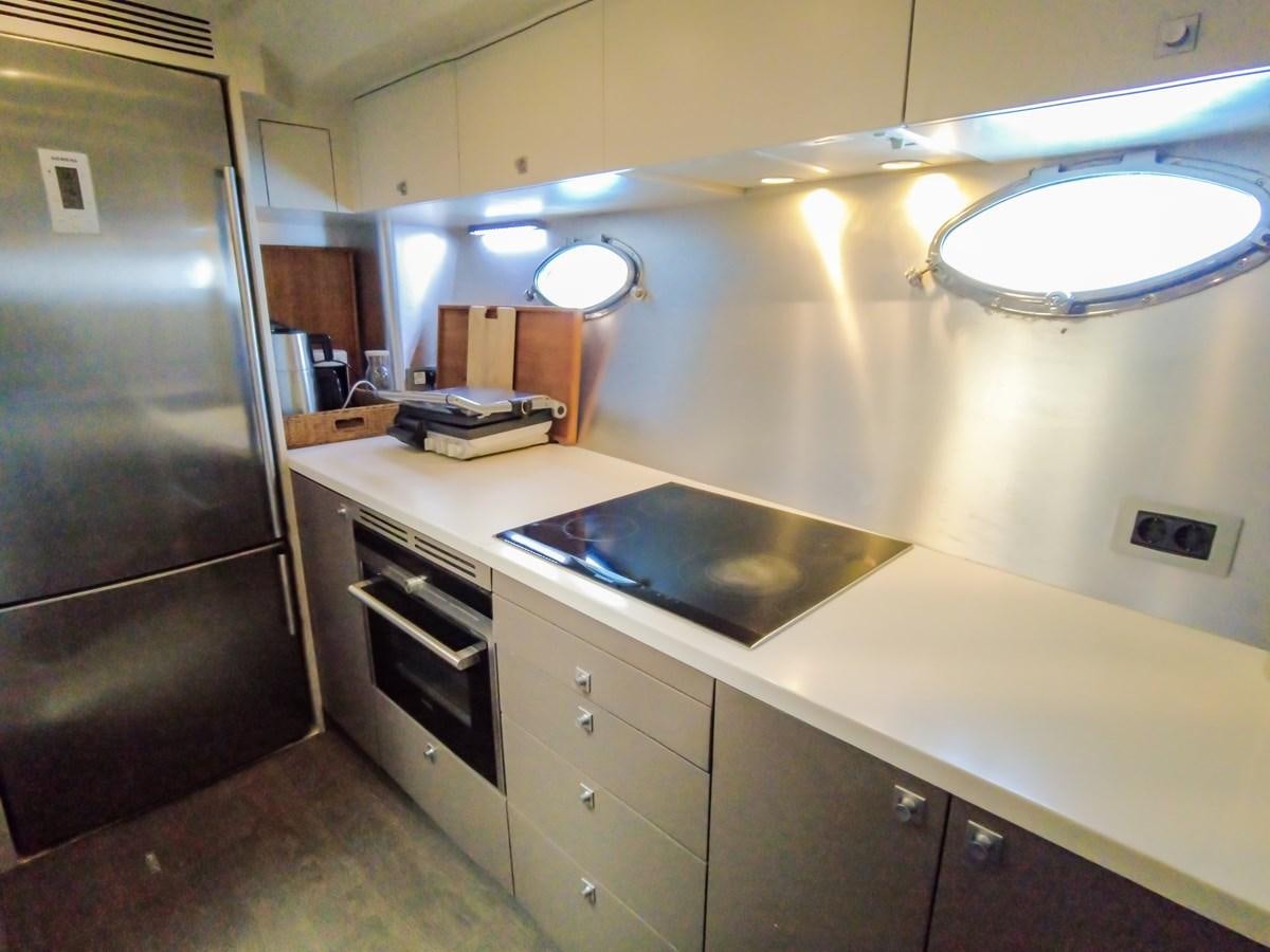 a kitchen with a stainless steel stove aboard MELITEA Yacht for Sale