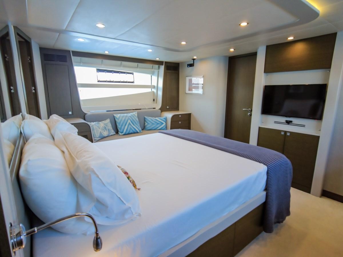 a room with a bed and a television aboard MELITEA Yacht for Sale