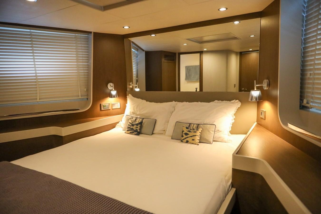 a hotel room with a large mirror aboard MELITEA Yacht for Sale