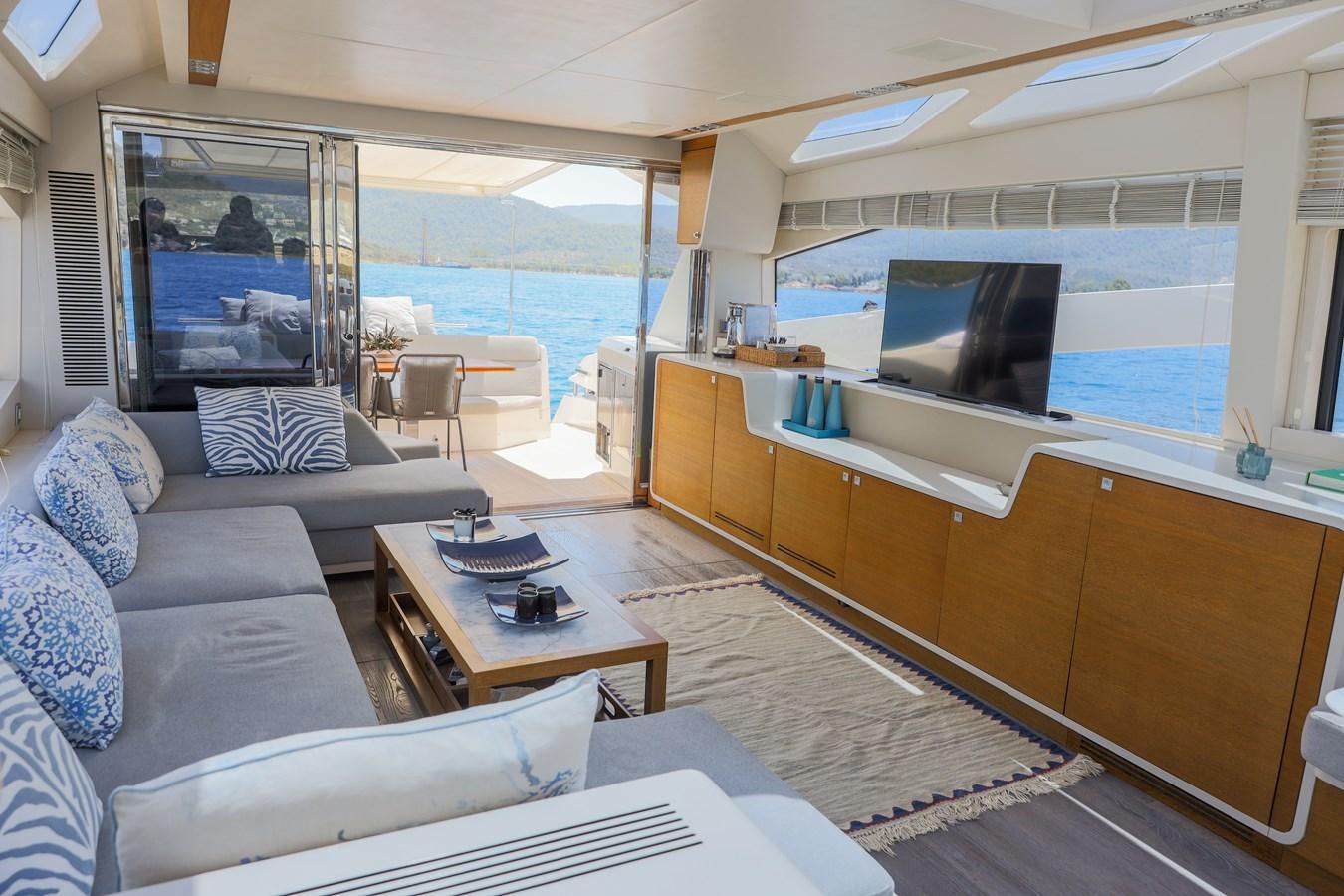 a living room with a large window aboard MELITEA Yacht for Sale