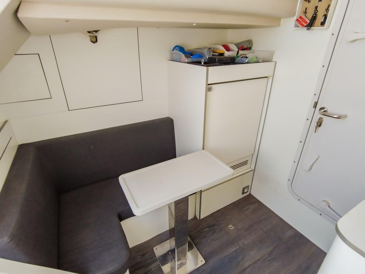 a couch and a table in a room aboard MELITEA Yacht for Sale