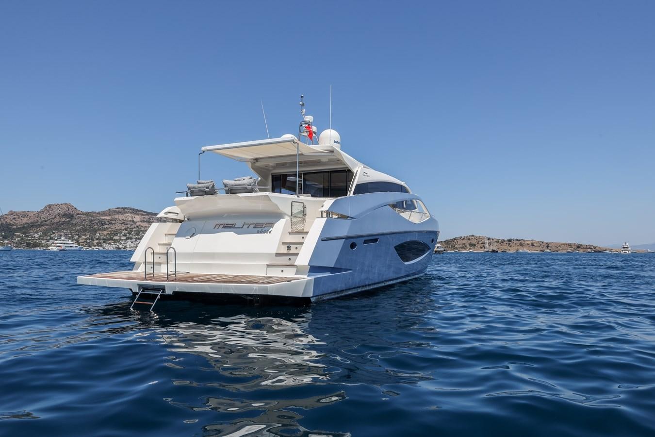 a white yacht in the water aboard MELITEA Yacht for Sale