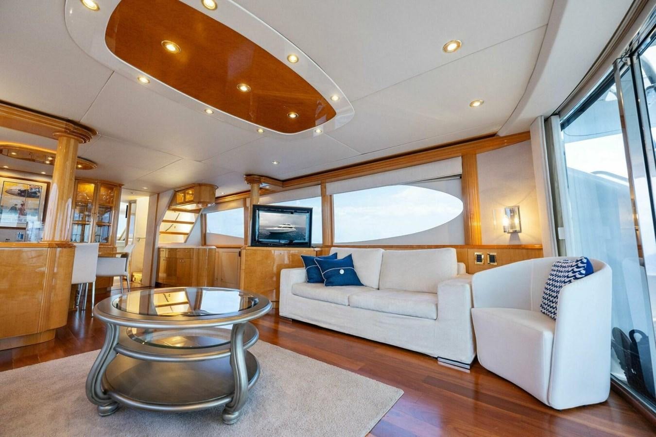 a living room with a table and couches aboard NORDLYS Yacht for Sale