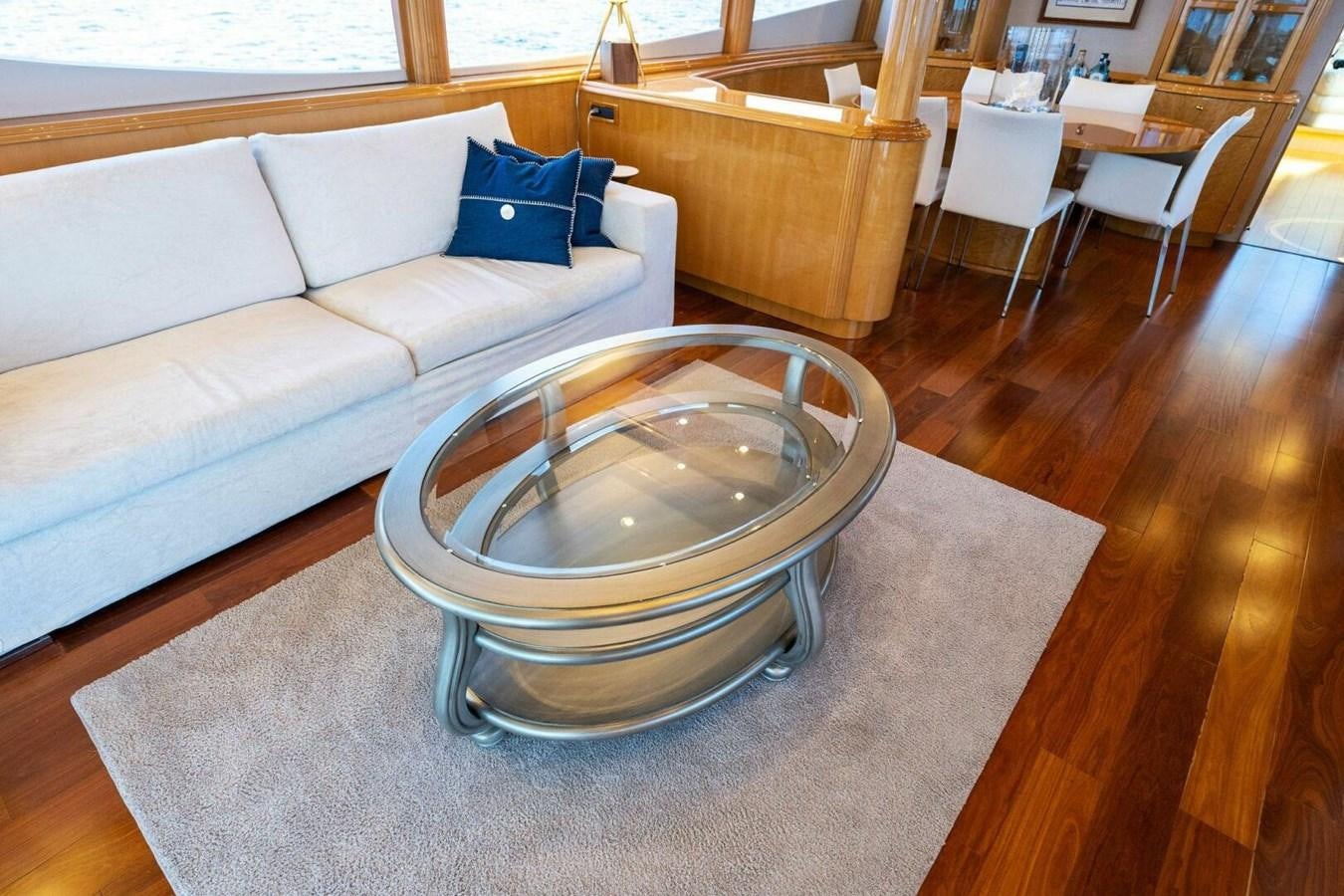 a living room with a couch and a table aboard NORDLYS Yacht for Sale