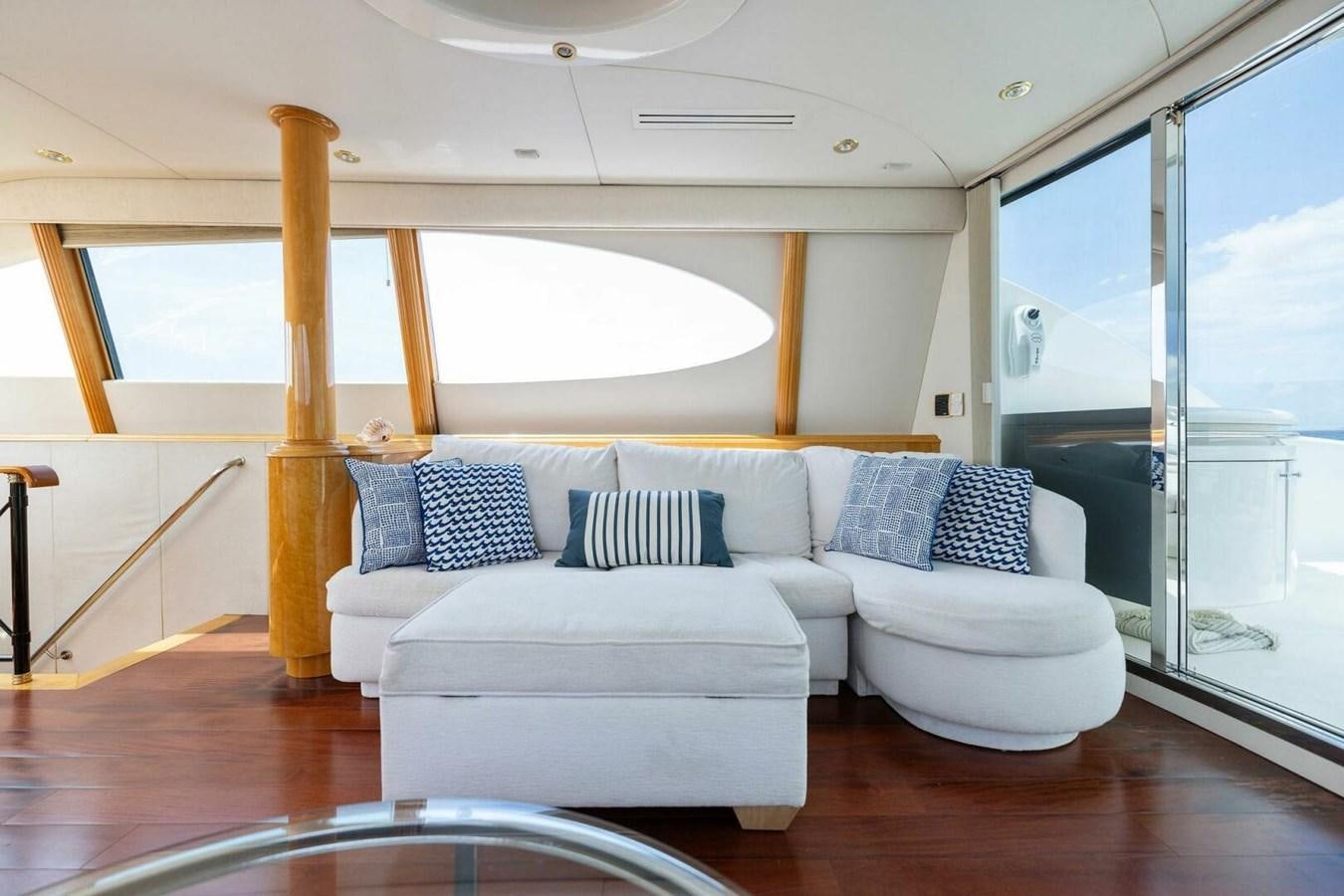a living room with a large window aboard NORDLYS Yacht for Sale