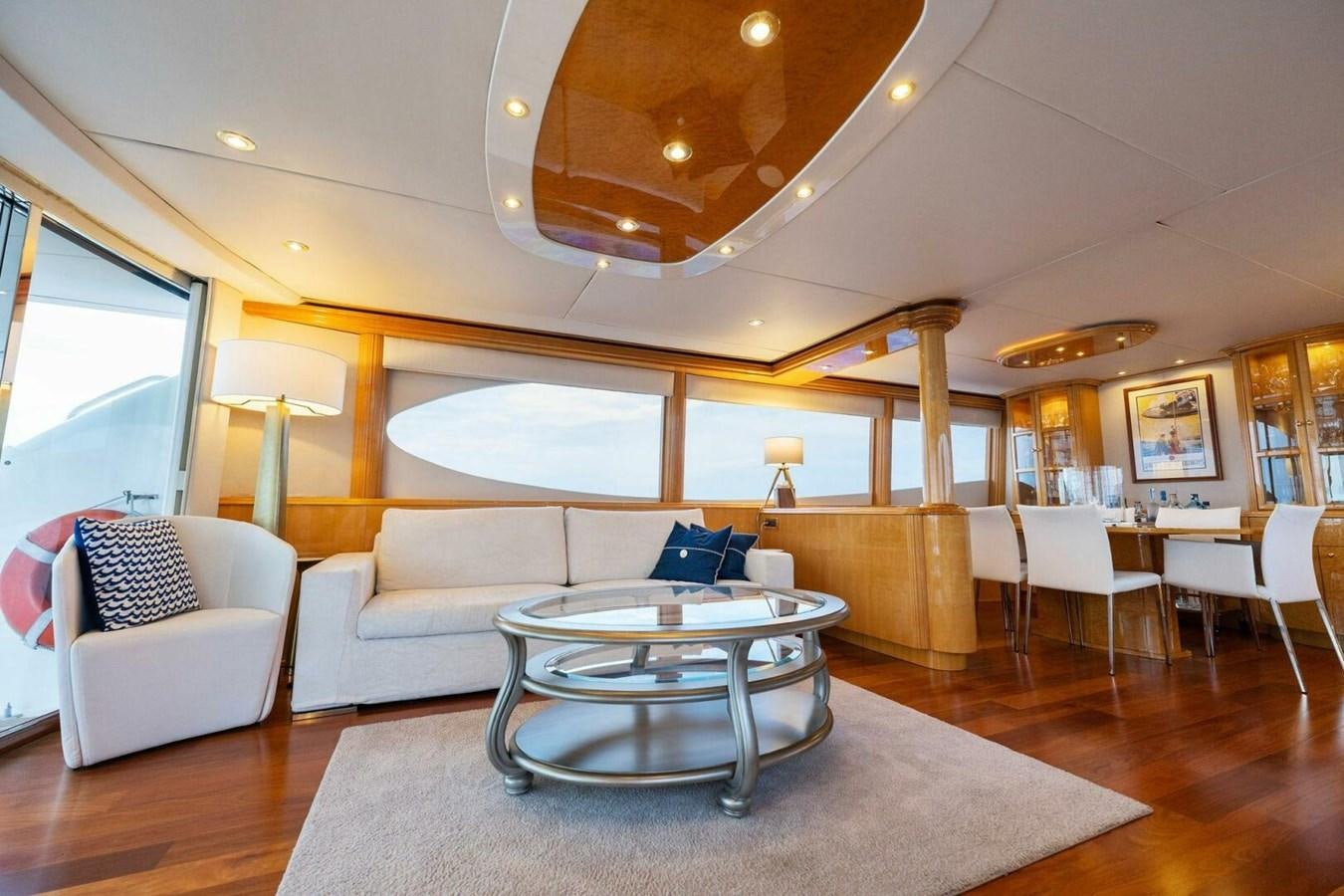 a living room with a table and chairs aboard NORDLYS Yacht for Sale