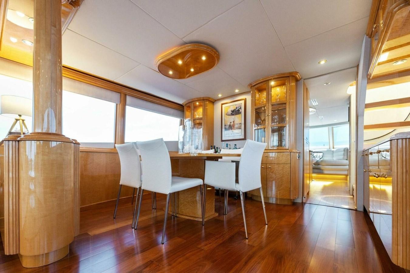 a room with a table and chairs aboard NORDLYS Yacht for Sale