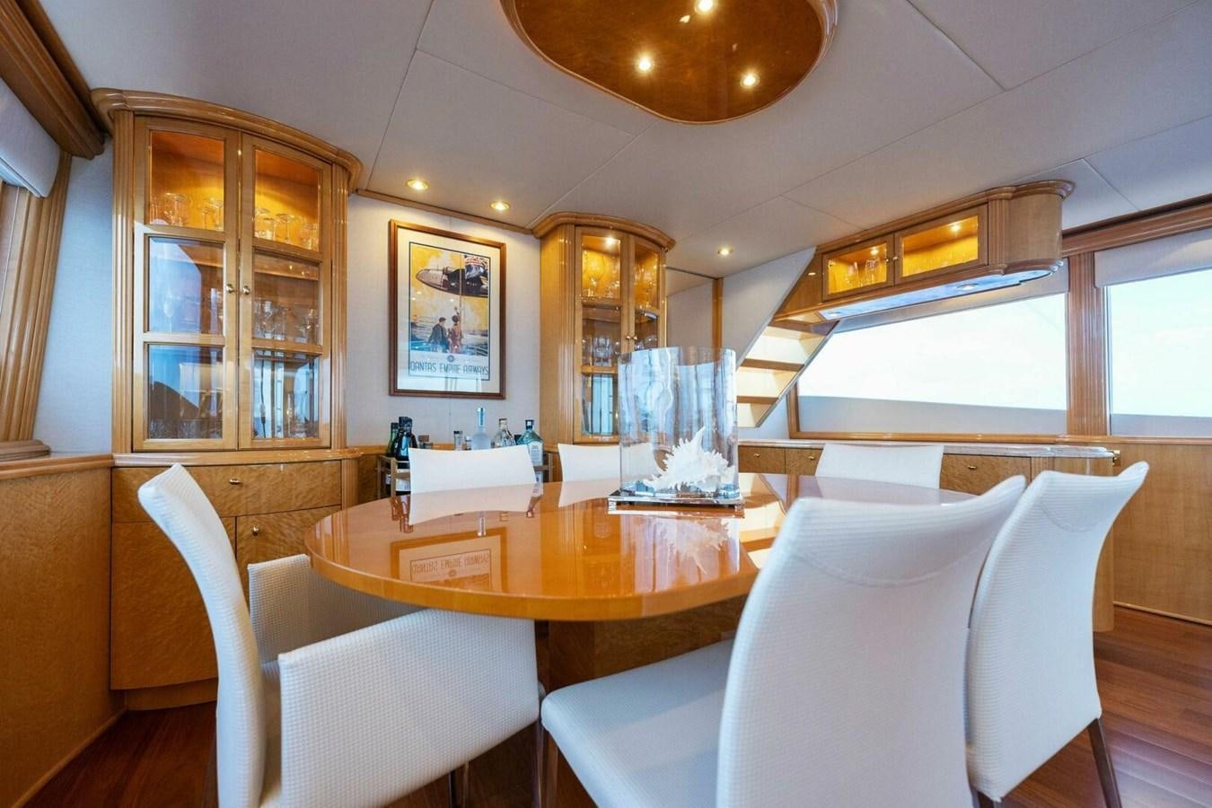 a dining room with a table and chairs aboard NORDLYS Yacht for Sale