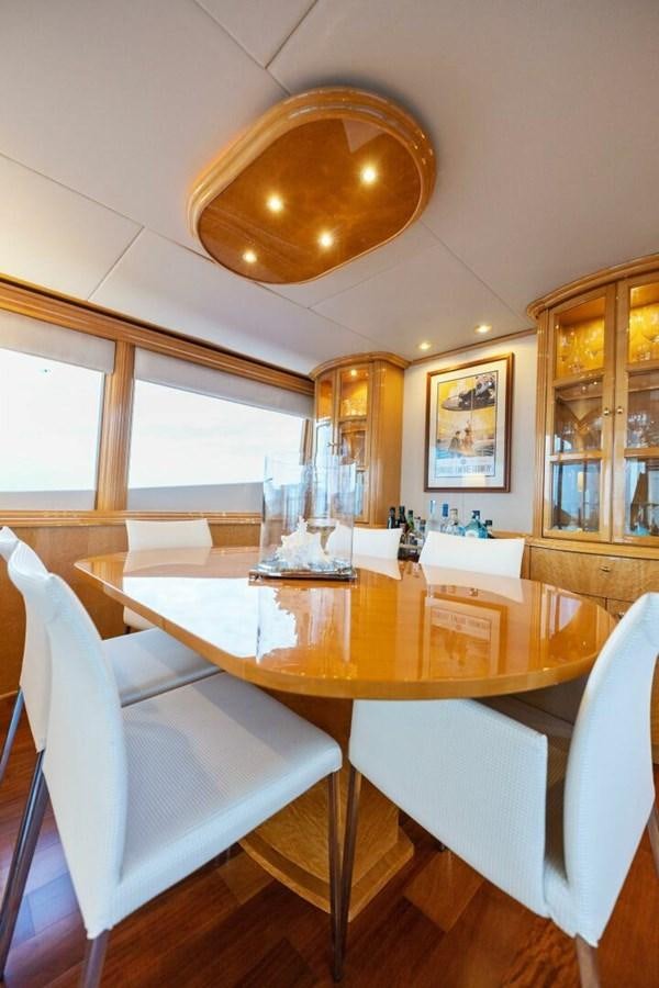a dining room with a large chandelier aboard NORDLYS Yacht for Sale