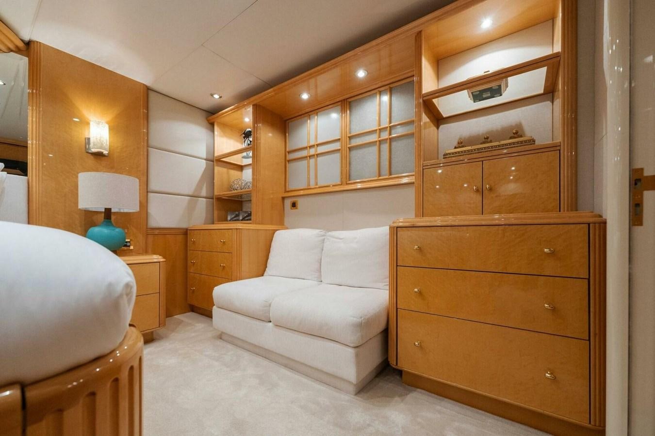 a room with a bed and a couch aboard NORDLYS Yacht for Sale
