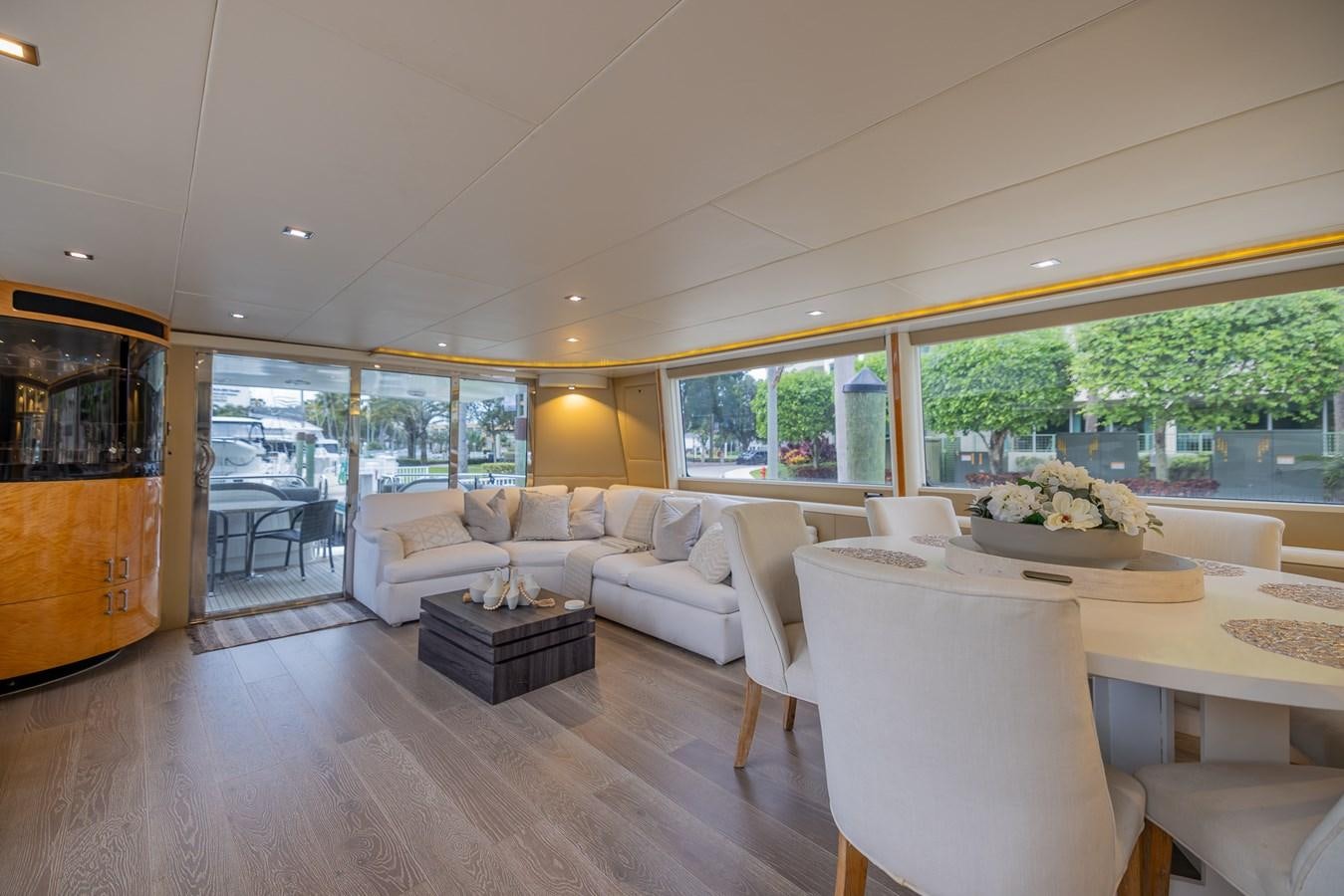 a living room with a large window aboard BOURBON LEGEND Yacht for Sale