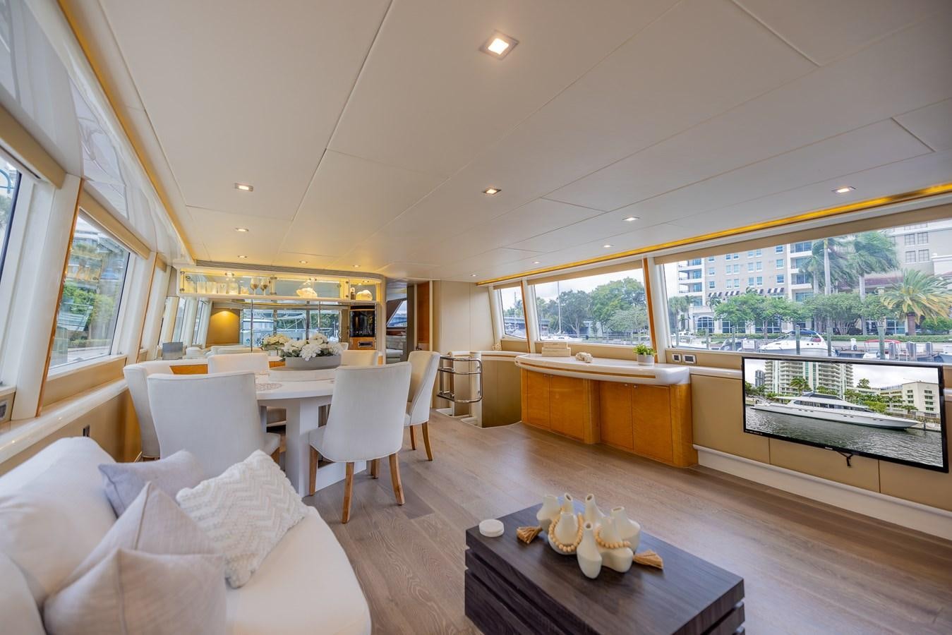 a living room with a table and chairs aboard BOURBON LEGEND Yacht for Sale
