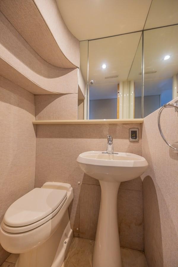 a bathroom with a sink and toilet aboard BOURBON LEGEND Yacht for Sale
