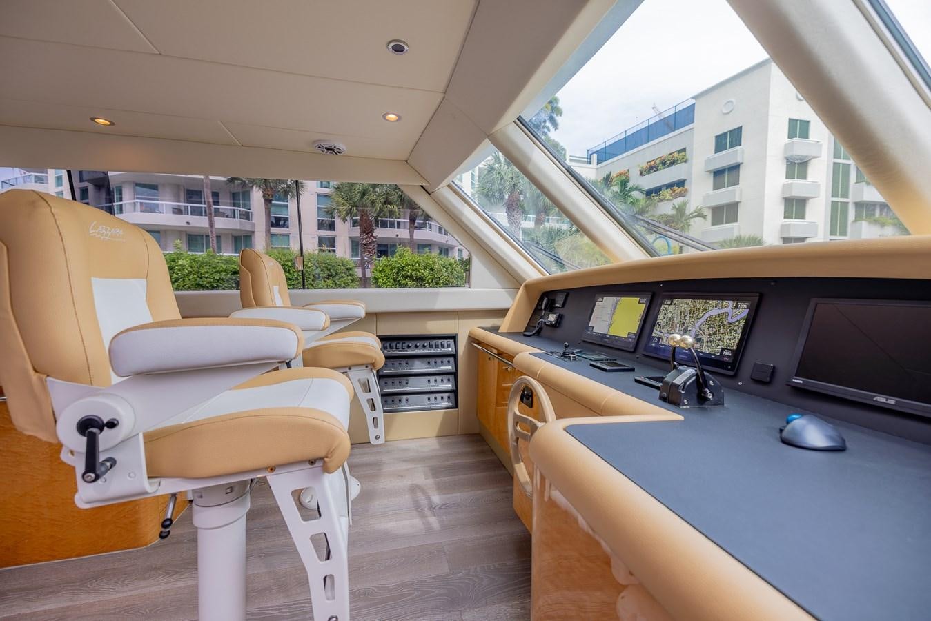a room with a table and chairs aboard BOURBON LEGEND Yacht for Sale