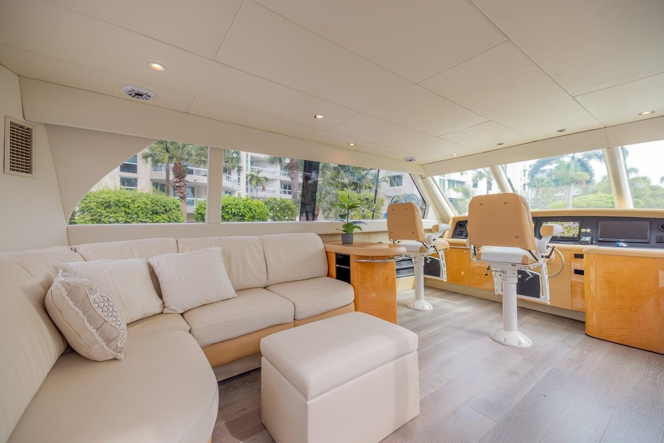 a living room with a couch and a table aboard BOURBON LEGEND Yacht for Sale