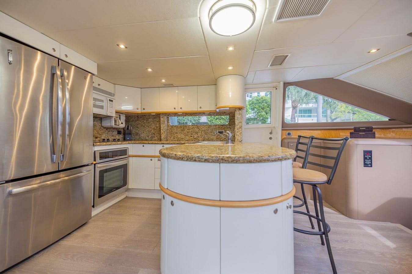 a kitchen with a large island aboard BOURBON LEGEND Yacht for Sale