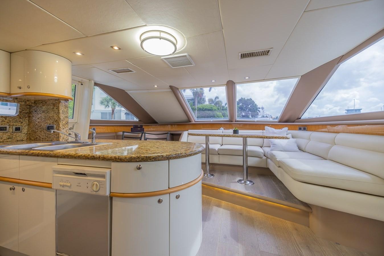 a kitchen with a large window aboard BOURBON LEGEND Yacht for Sale