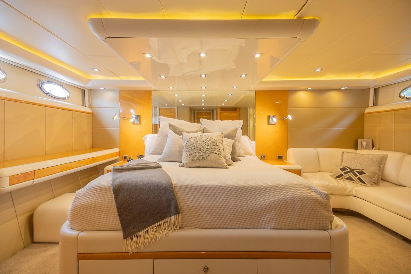 a room with a bed and a couch aboard BOURBON LEGEND Yacht for Sale