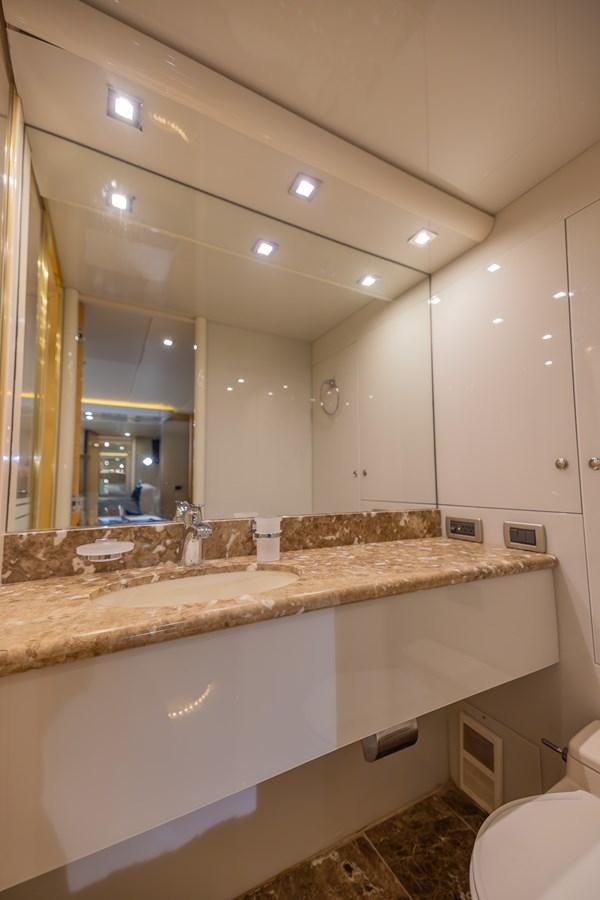a bathroom with a large mirror aboard BOURBON LEGEND Yacht for Sale