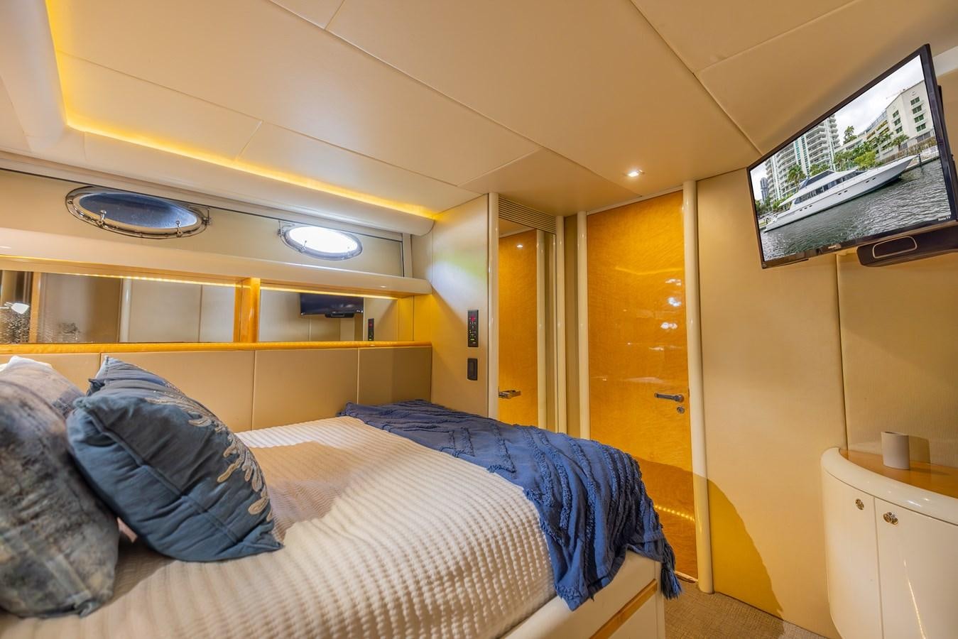 a small bedroom with a bed aboard BOURBON LEGEND Yacht for Sale