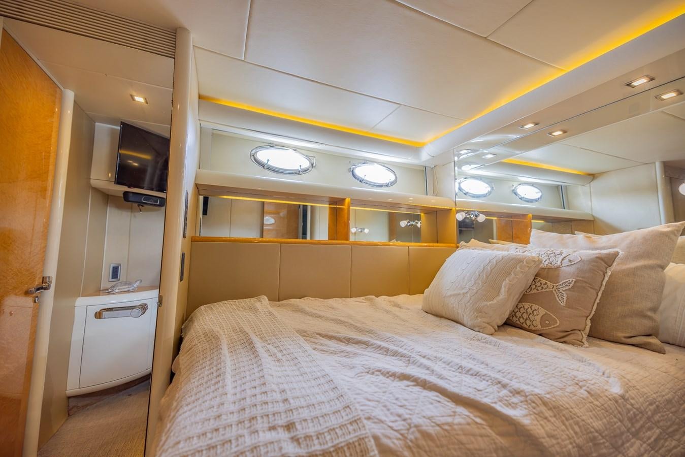 a bed with white sheets aboard BOURBON LEGEND Yacht for Sale