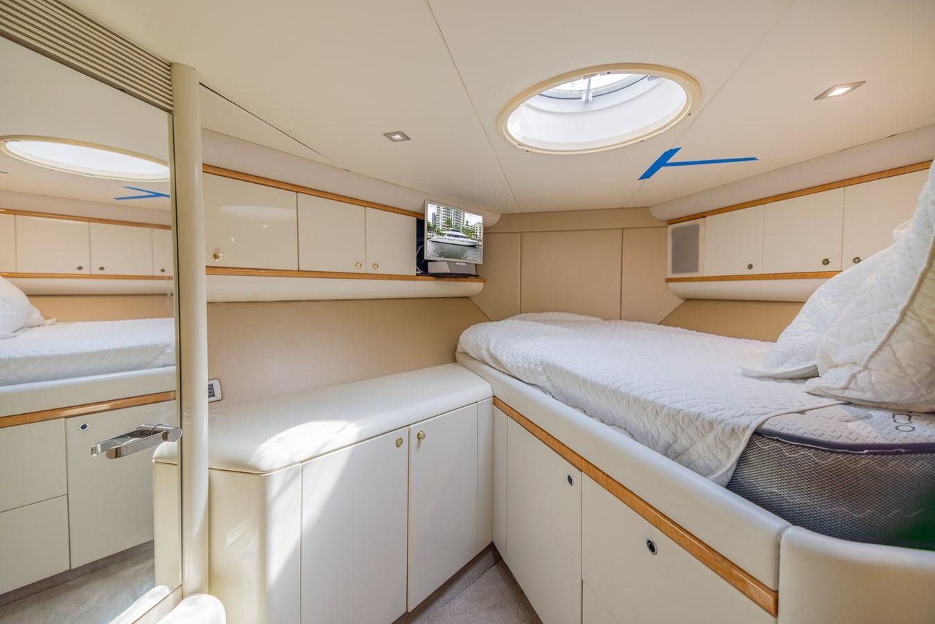 a small bedroom with a bunk bed aboard BOURBON LEGEND Yacht for Sale