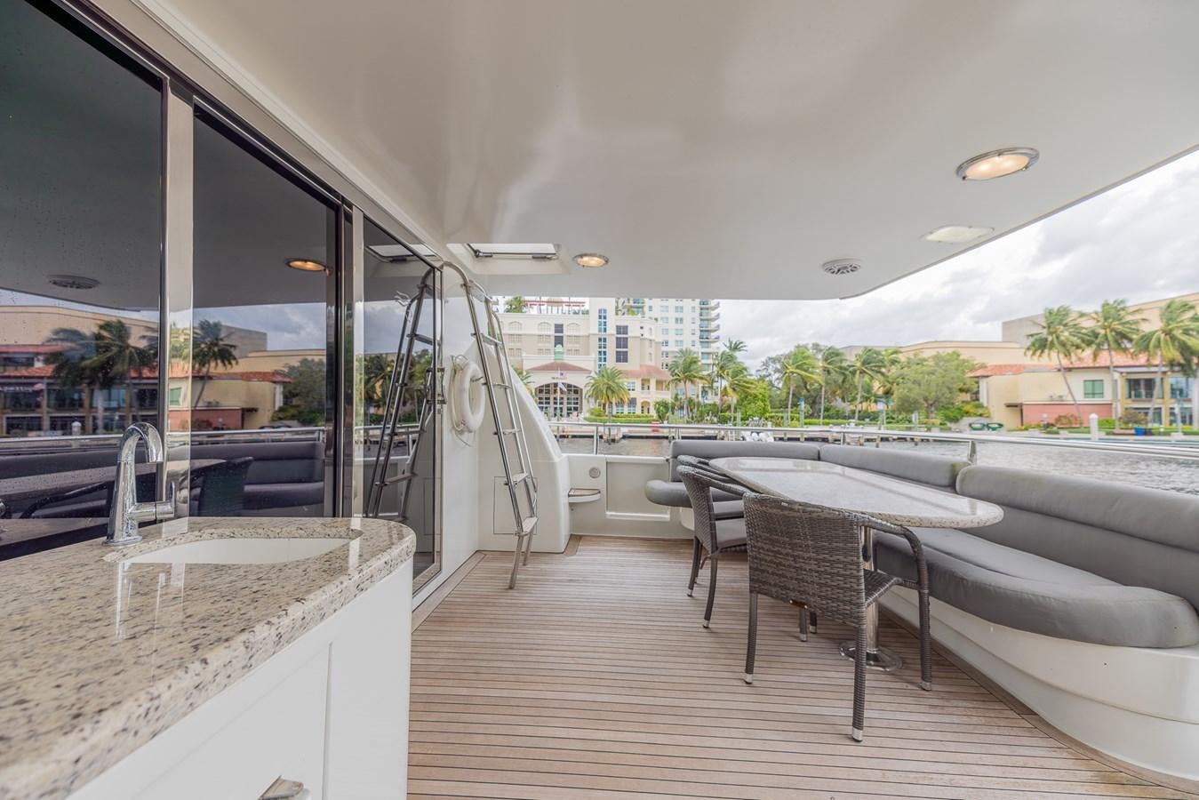 a room with a table and chairs aboard BOURBON LEGEND Yacht for Sale