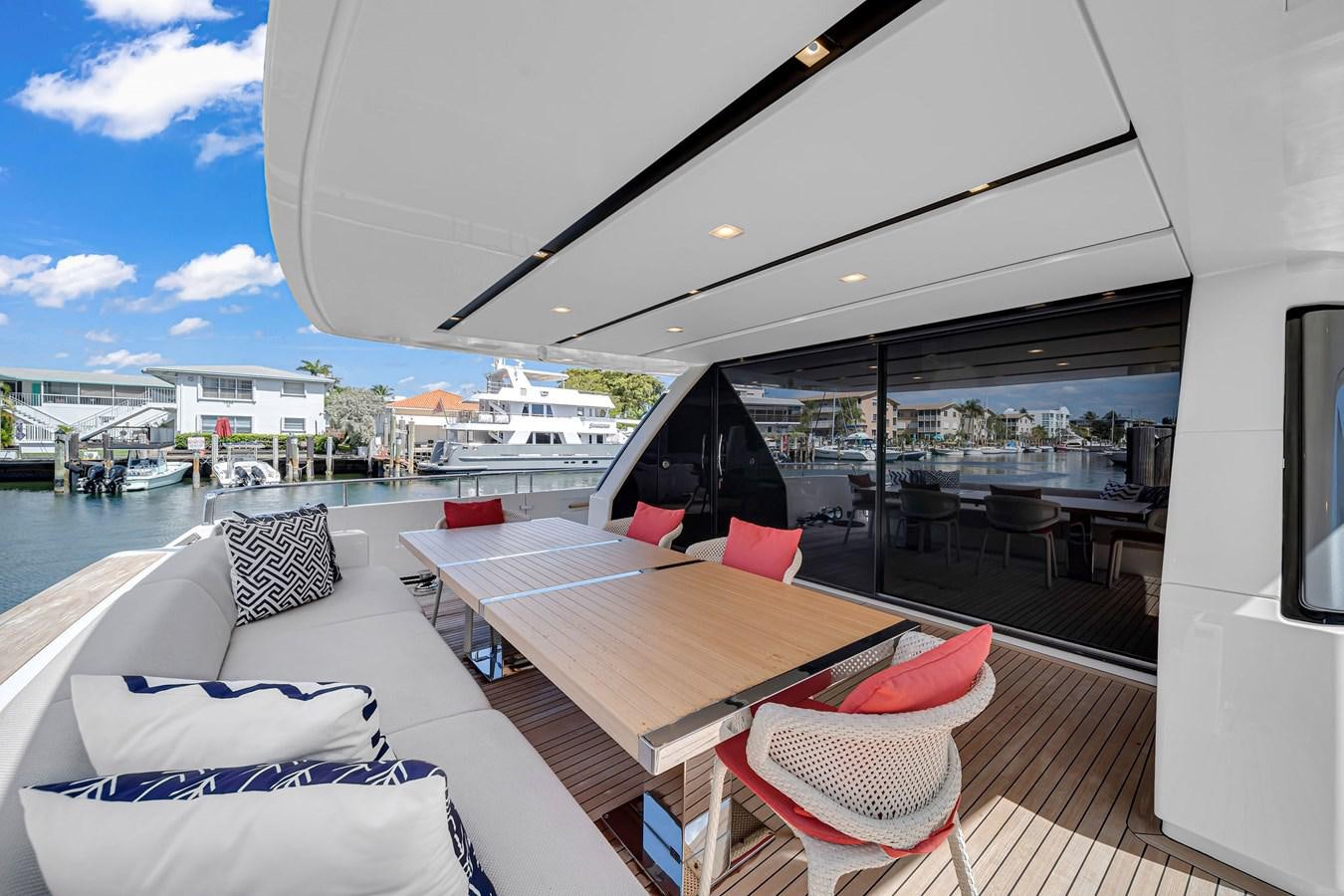 a deck with chairs and a table on it aboard SL86/728 Yacht for Sale